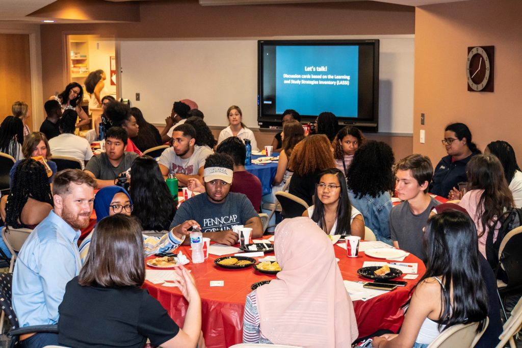Ryan Miller (left front) meets with students in August 2019, when the Weingarten Center collaborated with PennCAP to host students participating in the Pre-Freshman Program. (Image: Steve McCann)