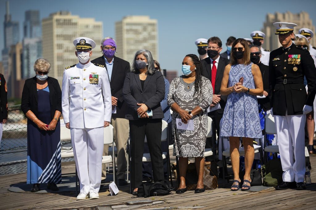 Tamara King stands with NROTC staff and parents during the Spring Commissioning Ceremony.