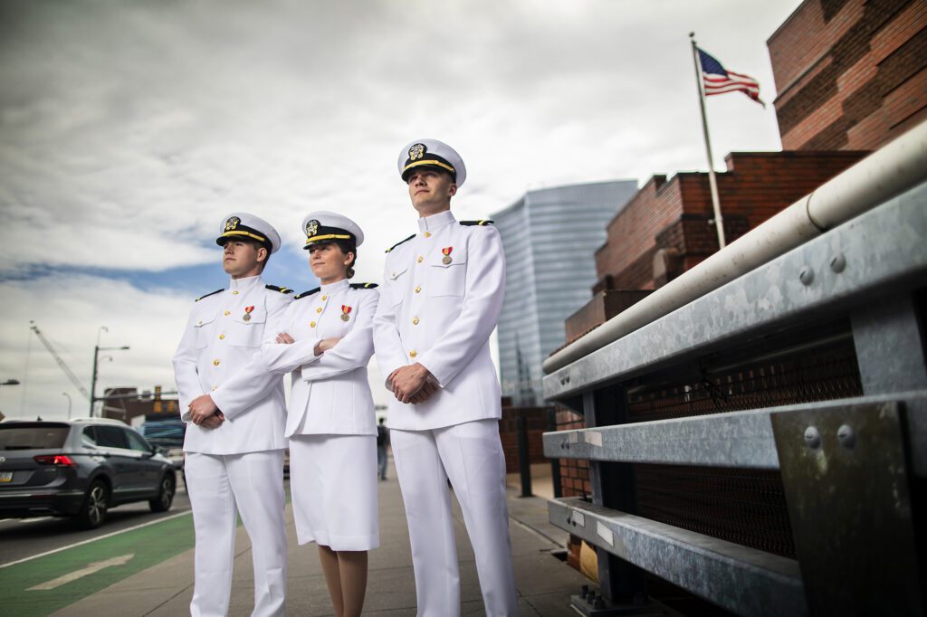 NROTC graduates from left to right: Allan Cate, Madeline McAvoy, and Robert Blend. All three are commissioned officers, as of a May 14 ceremony.