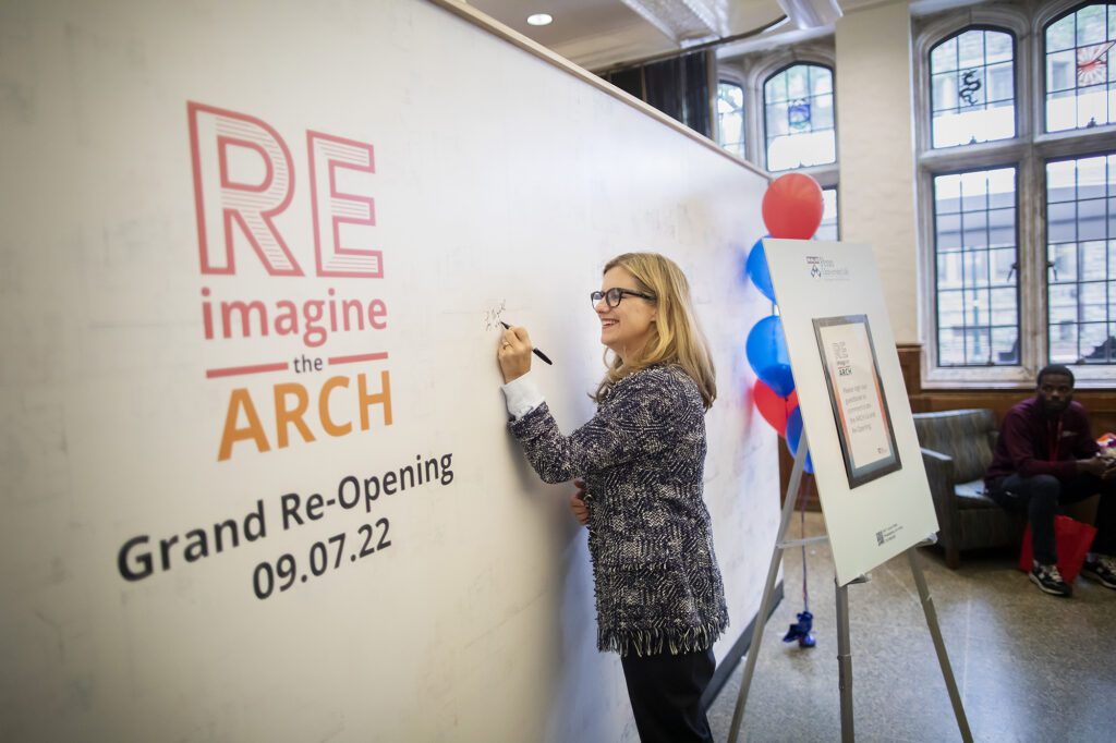 Liz Magill signs the ARCH reimagine wall