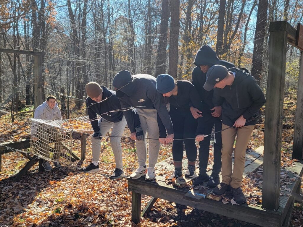 Midshipmen lead each other through Leadership Reaction Courses specifically designed to test their teamwork and problem-solving capabilities.