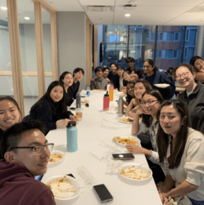 Eating dinner together at a college house dining hall